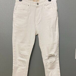 Levi Strauss white 721 Hi-rise ankle raw hem distressed jeans.